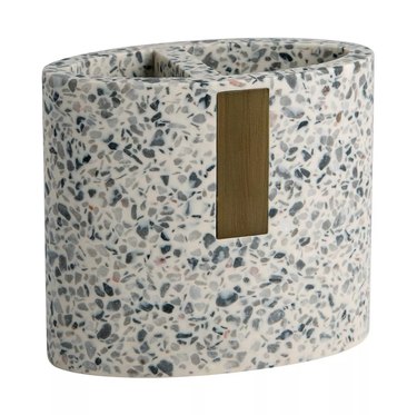 Gray terrazzo toothbrush holder with wood accent