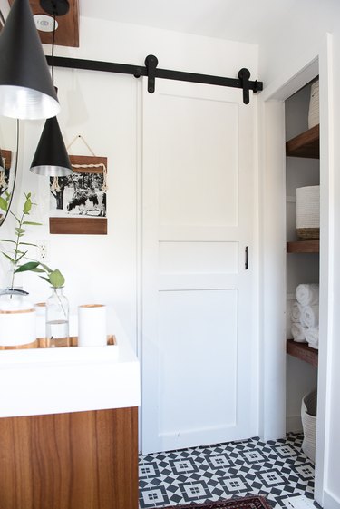 White DIY small bathroom door that slides on rail