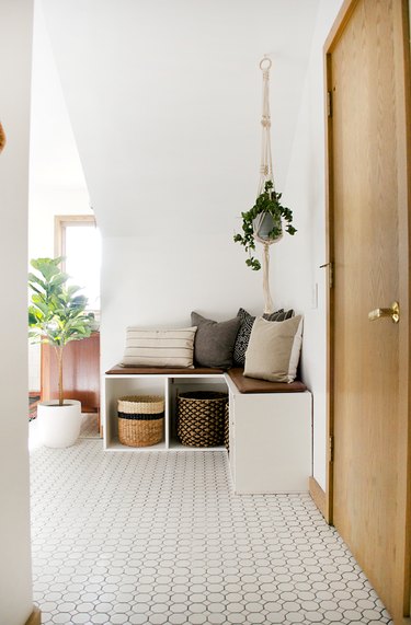 Boho Bathroom Storage in large boho bathroom with corner storage and seating unit