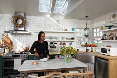 woman cooking food in kitchen