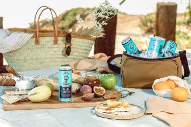 picnic scene with food and drinks