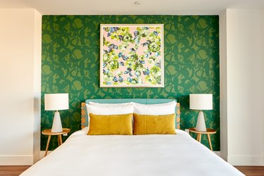 bedroom with green accent wall