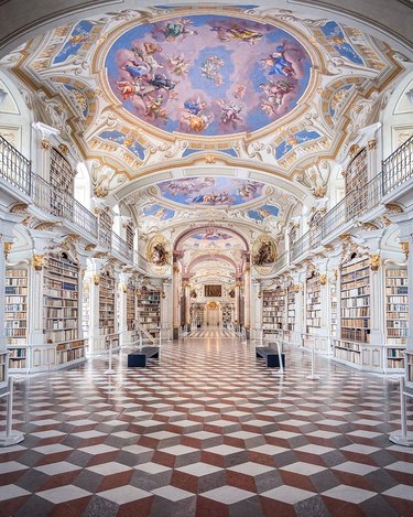 interior picture of the admont abbey library with art on ceilings