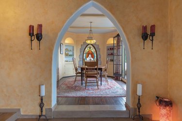 interior with arched entry and dining space