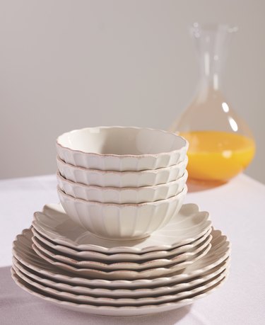 plates and bowls stacked on table