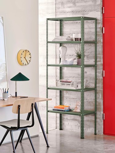 gray home office with industrial green open bookcase