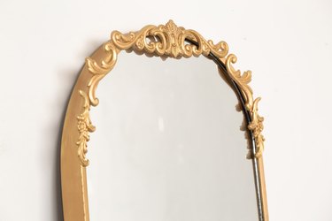 top edge of a gold mirror
