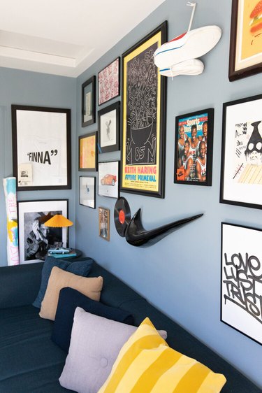 Duett Interiors founder Tiffany Thompson office with blue walls and art gallery wall