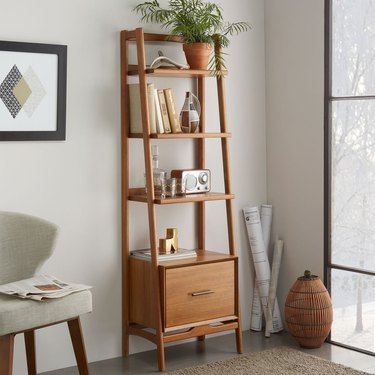 midcentury modern hallway with narrow wood bookshelf