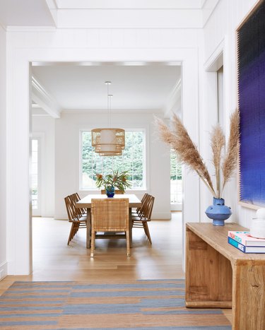 scandinavian hallway with blue and beige rug