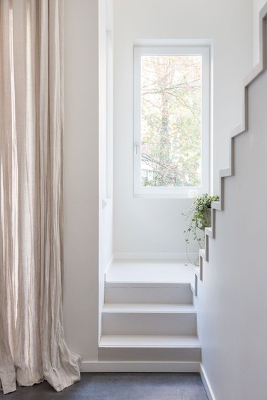 scandinavian hallway with neutral drapes