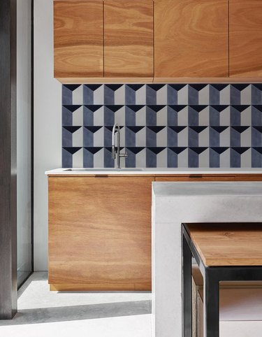 blue triangle mid-century wallpaper backsplash in modern kitchen