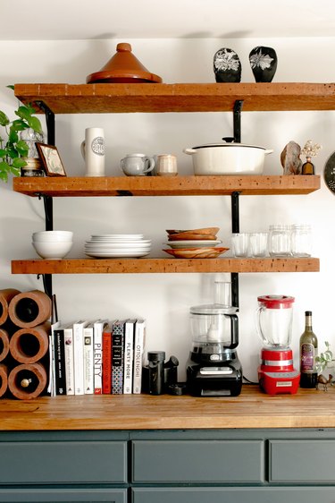 Butcher-Block countertop in kitchen with matching shelfs above the countertops