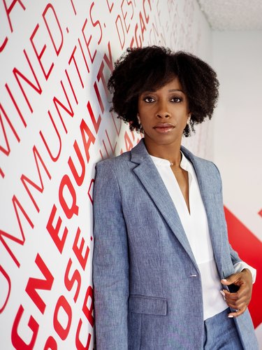 photograph of Kia Weatherspoon against white and red wall with text