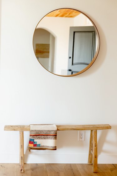 minimalist hallway round mirror