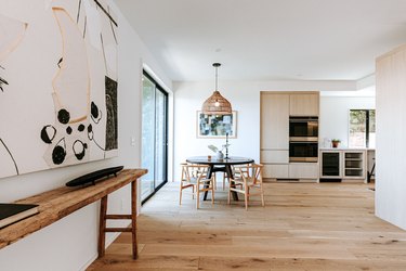 hardwood floor with dining table and chairs