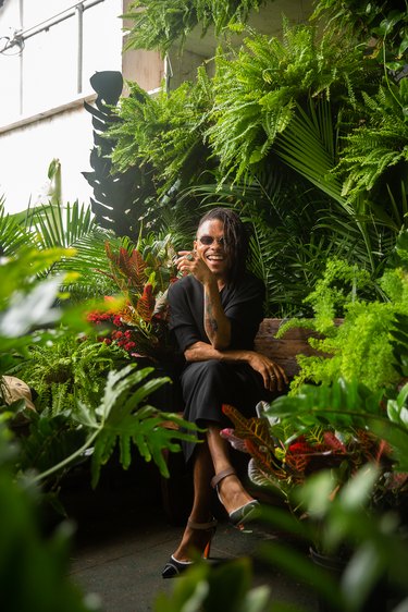 person sitting amidst plants