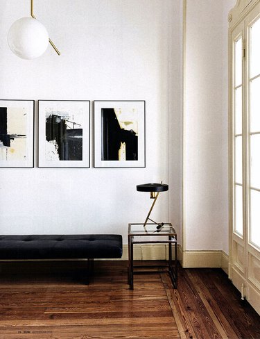 minimalist hallway entryway with black and gold accents