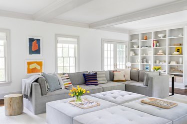 secondary colors in neutral living room with sparse color accents