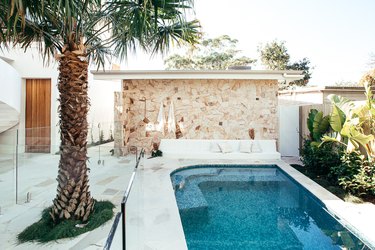 contemporary landscape with swimming pool and sandstone details