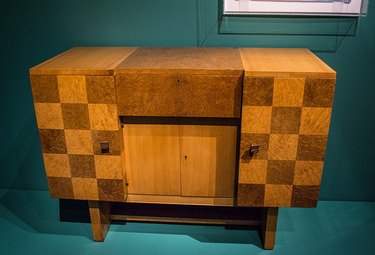 A 1930, Art Deco-inspired cabinet by Eugene Schoen that includes burl wood as a material