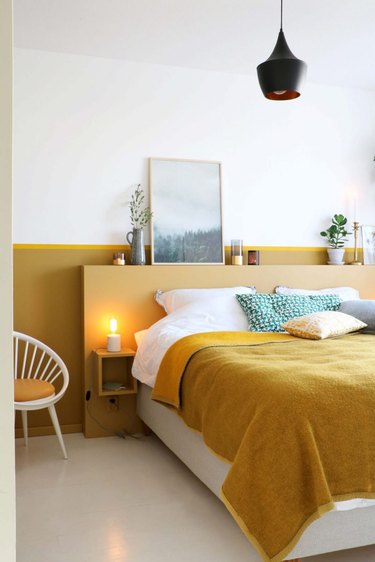 contemporary colors in bedroom with pops of mustard yellow