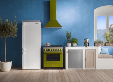 kitchen with blue wall and appliances in white and green