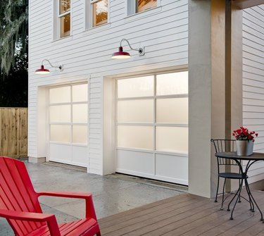 white garage door colors on white contemporary house with red chair.