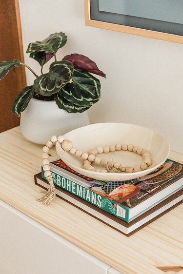 We love styling with stacks of books and potted plants.