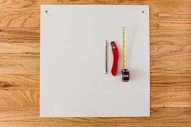 Measure, mark, and cut out any necessary holes for cables and outlets.