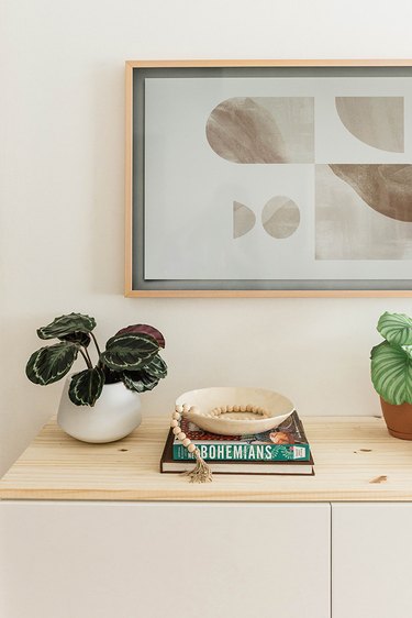 This floating TV console is made by customizing an IKEA BESTA unit.