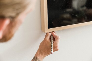 Lightly mark the corners of your television on the drywall.