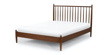 spindle bed frame with white mattress