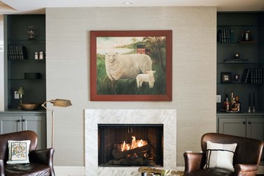 Stone contemporary fireplace mantel and grasscloth wallpaper by Prospect Refuge Studio