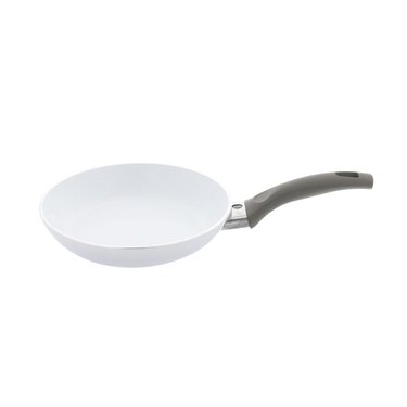 White ceramic nonstick cookware pan with gray handle on white background