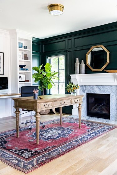 men's home office ideas with dark green paneled walls