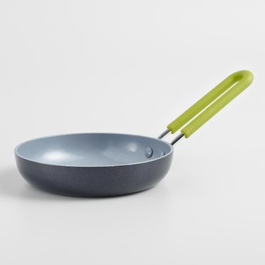 Gray ceramic nonstick cookware pan with bright green handle