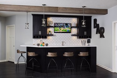 garage bar ideas with white subway tile and barstools