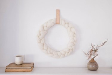 Braided wool wreath with leather hanger