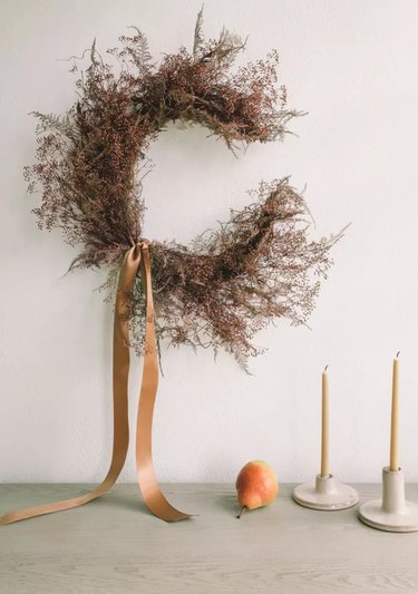 Thanksgiving wreath with ribbon in crescent moon shape
