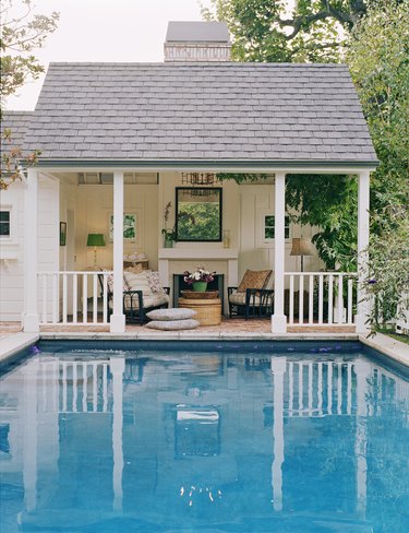 Seating and Fireplace in Covered Porch by Pool