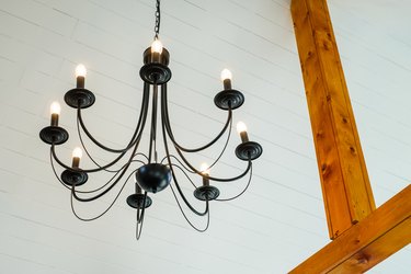 Modern electric ceiling lamp designed as old-style chandelier
