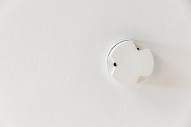 Smoke detector on a white ceiling