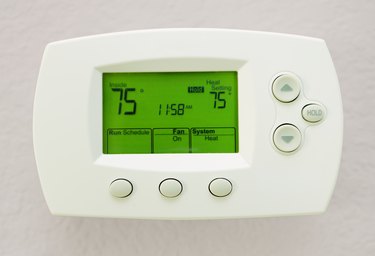 Programmable Digital Thermostat Showing 75 Degrees In Fahrenheit's