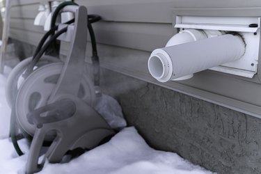 Furnace exhaust pipe blowing out steam in winter