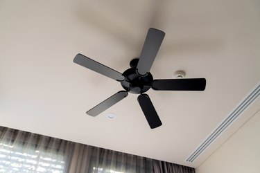Moving ceiling fan in a hotel room,indoor hanging decorate ceiling fan install in bedroom hotel interior design