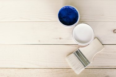 Directly Above Shot Of Paint Can With Brush On Table