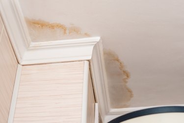 Neighbors have a water leak, water-damaged ceiling, close-up of a stain on the ceiling