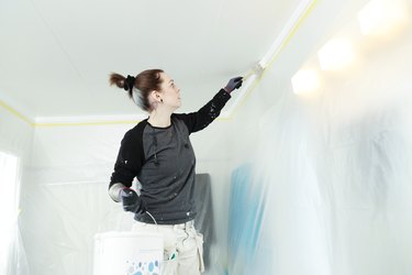 Painting a ceiling.