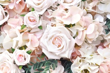 Artificial light-pink and white roses.